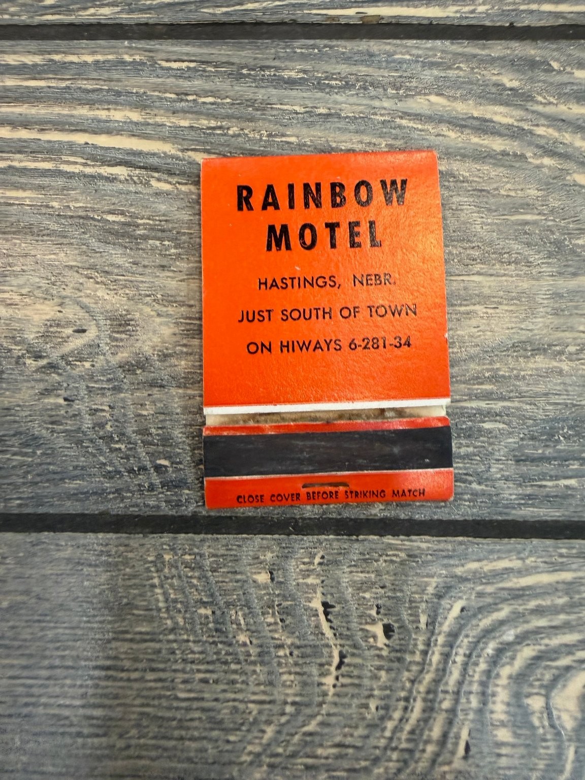 Rainbow Motel Hastings Nebr. Mid-Century Orange Black Advertising Matchbook